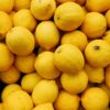 yellow citrus fruits on black surface
