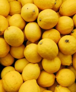 yellow citrus fruits on black surface