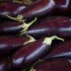 red round fruit on brown wooden table