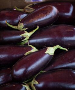 red round fruit on brown wooden table