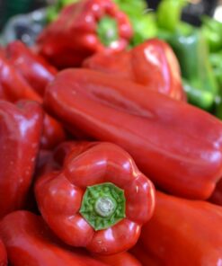 red bell pepper on brown wooden table