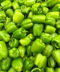 green bell pepper on brown wooden table
